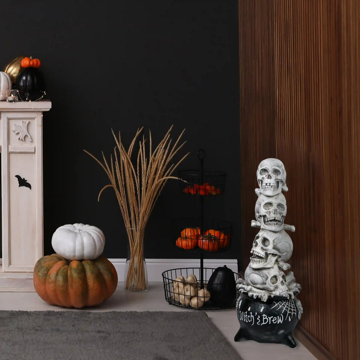 38 in. Halloween Stacked Skulls in a Cauldron Tabletop Decoration
