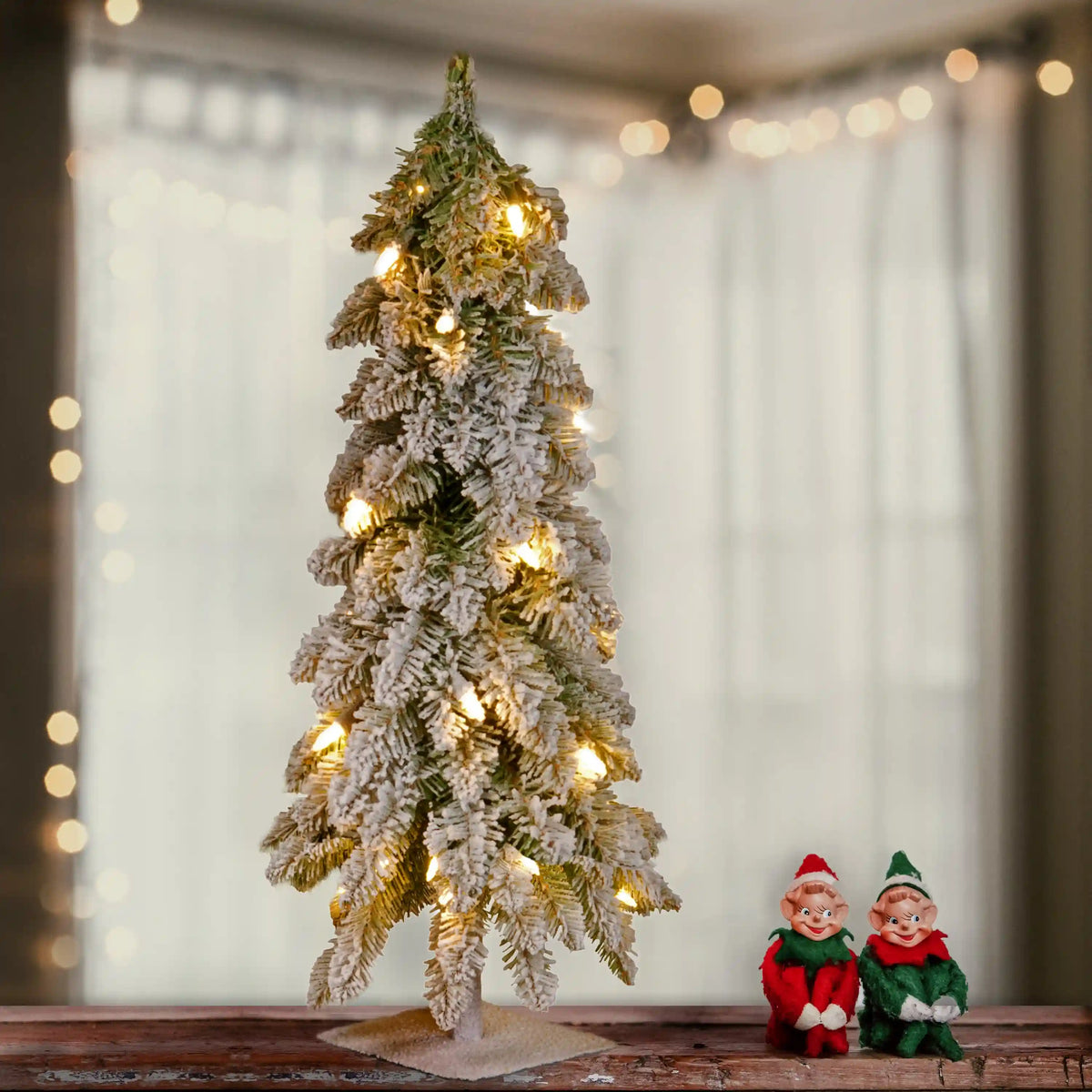 2 ft. Pre-Lit Snowy Downswept Forest Tree with Clear Lights, Plug-In