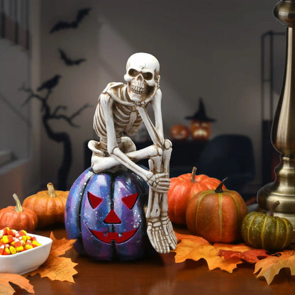 11 in. Halloween Skeleton Resting on a Purple Galaxy Jack O Lantern