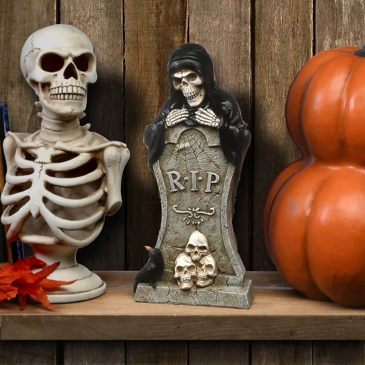 12 in. Halloween Skeleton Behind a Tombstone Decoration